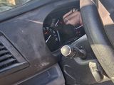 dashboard view of a car with a steering wheel and dashboard controls
