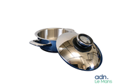 a silver pan with a clock on top of it