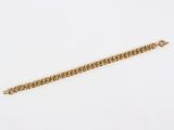 a gold chain bracelet with a clasp on a white background