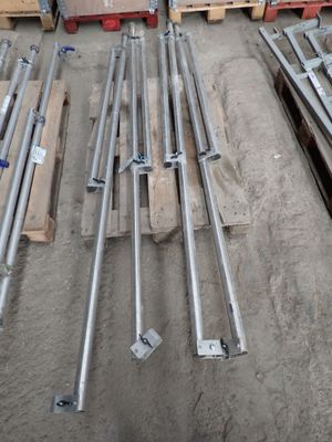 many different types of steel pipes on the ground
