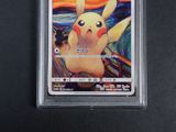 the pokemon card has a picture of a pikachu on it