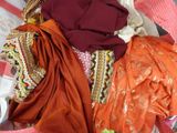 a suitcase full of clothes and a pair of shoes