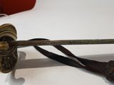 a sword that is sitting on top of a table