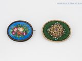 two buttons that have been decorated with flowers on them