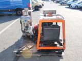 a machine that is sitting on a cart in the parking lot