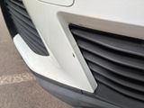 a close up of the front of a white car