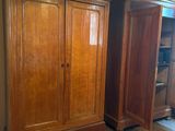 a large wooden cabinet in the corner of a room