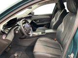the interior of a car with the door open and the driver seat down