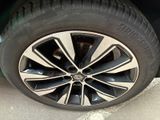 the tire of a car is shown with the rim on it