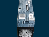 a box of toothpaste sitting on a blue surface