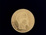 l'image d'une pièce d'or sur laquelle figure une tête de femme
