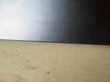 an open laptop computer sitting on top of a wooden table