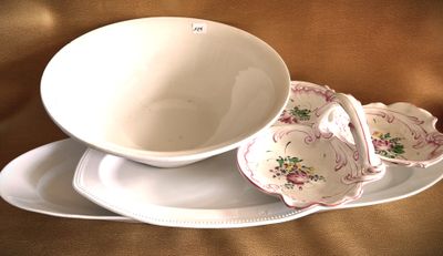 a white plate with a bowl on it and a plate with a bowl on it