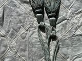 two brushes that are laying on top of a quilt