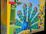 a box of lego creators with a picture of a peacock on it