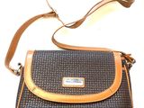 brown and black handbag with tan trim on a white background