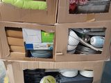 boxes stacked on top of each other on a pallet in a warehouse