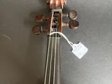 an old violin with a wooden case sitting on top of a table