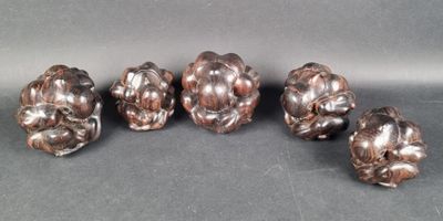 six antique silver plated figurines of flowers on a gray background