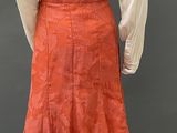 an orange skirt with a white shirt on a mannequin mannequin mannequin mannequin mannequin mannequin mannequin manne
