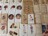 a lot of old postcards on the table