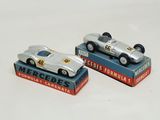 two toy cars that are sitting on top of each other