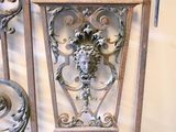 a metal gate with a lion head on it