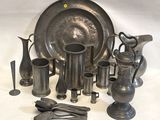 a lot of silver items that are on the table