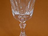 a wine glass that is sitting on a table