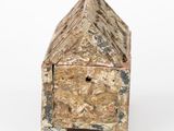 a small wooden box with a door on top of it