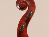 an old violin with a wooden back and a long neck