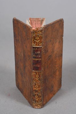 an old book that is sitting on a table