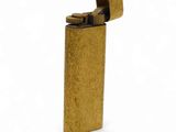 a gold lighter on a white background