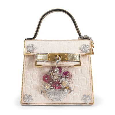 a close up of a white purse with flowers on it