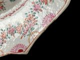 a white plate with a floral design on it