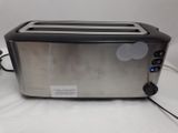 a toaster that is sitting on a white table