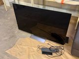 a lot of tvs that are sitting on the floor