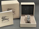a box with a watch inside of it and a box with a watch inside of it