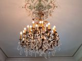 a chandelier hanging from the ceiling in a room