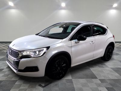 the white car is parked on a checkered tile floor