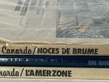 several books are stacked on top of each other on a table