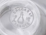 a close up of a glass of water with a logo on it