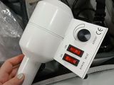 a person holding a blow dryer in a bag
