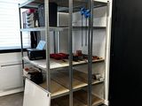 a room that has a bunch of shelves in it