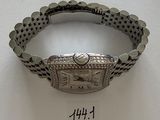 an image of a wrist watch with diamonds on a white surface