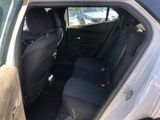 the back seat of a car with the door open in a parking lot