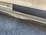 a close up of a car ' s door handle and door handle