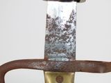 a very old looking knife with a rusty handle