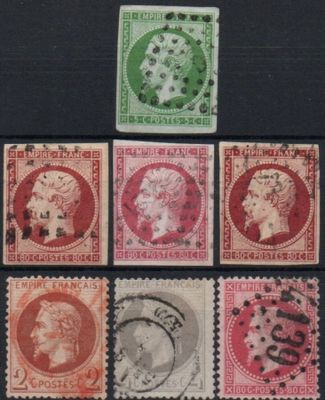 a close up of a group of stamps on a black surface