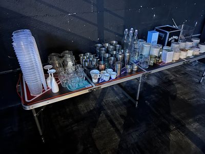 a table with a lot of glasses and cups on it